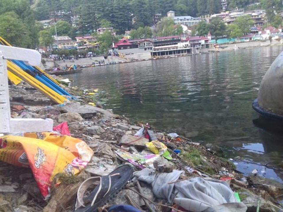 Plastic and other solid waste piled along Naini Lake shore. 